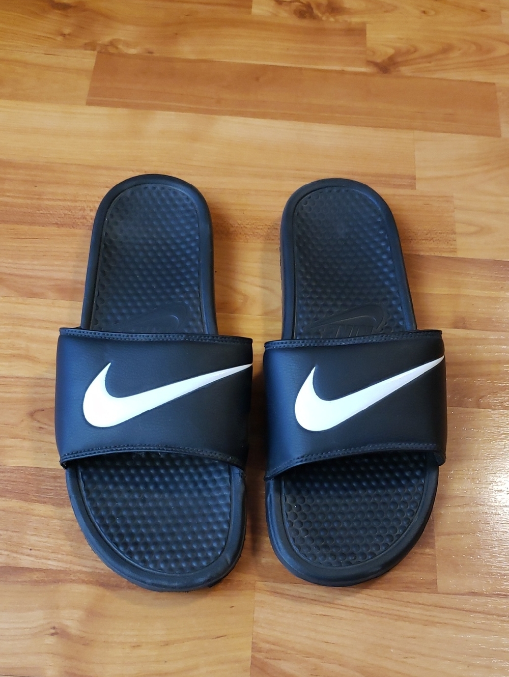 Nike Black Slides with White Swoosh Logo